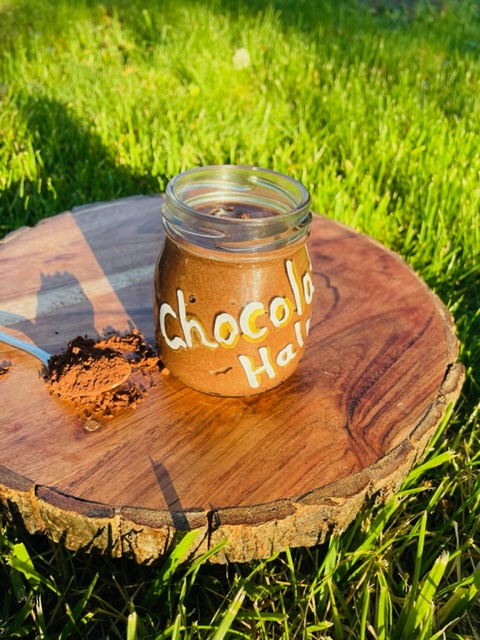 Jar of Chocolate Halva on Wood Decorative